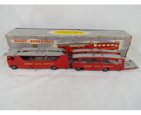 Dinky Toys - a boxed Dinky toy #983 car carrier with trailer, red body with grey decks and hubs, Dinky auto service decals, m