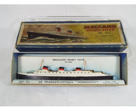 Dinky Toys - a French Dinky #52C La Normandie in white and black with insert, model appears very good in excellent original b