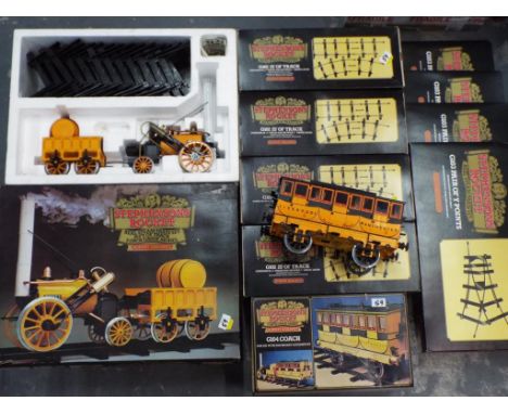 Stephenson's Rocket - Hornby 3.5 inch gauge model, a Real Steam Train Set with 25' of track # G100, in original box, a Coach 