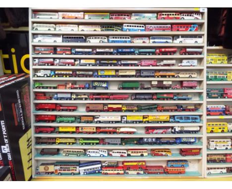 Diecast Models - a quantity of approx 105 diecast model motor vehicles in wooden display cabinet to include coaches, buses, a