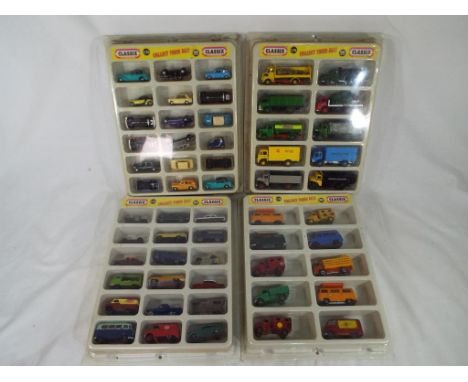 Diecast Models - Four plastic molded display cases advertising Classix 1.76 scale  00 gauge diecast model motor vehicles, all