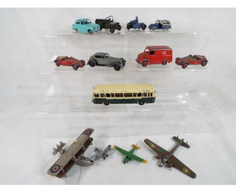 Dinky Toys - A collection of diecast model motor vehicles by Dinky to include, a Trojan advertising "ESSO", an Austin taxi, a