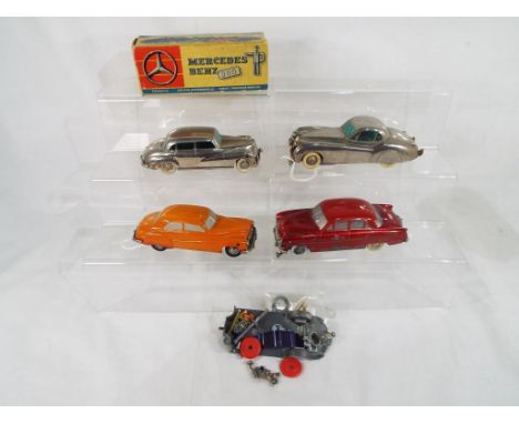 Prameta - four diecast clockwork model motor vehicles by Prameta to include Jaguar XK120 in chrome with white wheels, Buick 4