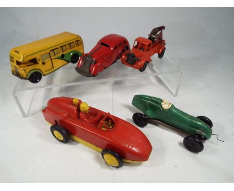 A tinplate Pocketoy Coach with clockwork mechanism, a red clockwork tinplate and plastic towtruck, a further red clockwork sa