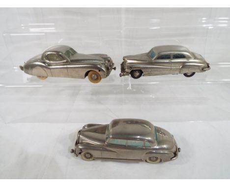 Prameta - three diecast clockwork model motor vehicles by Prameta to include Mercedes Benz 300 in chrome with white wheels, J