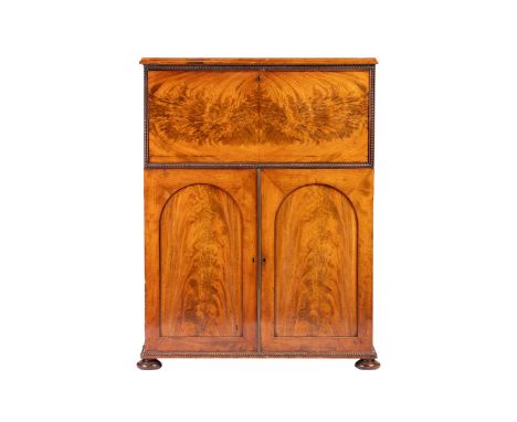 An unusual Regency Mahogany Secretaire cabinet in the manner of Gillows of Lancaster, the top drawer sliding on gilt brass me
