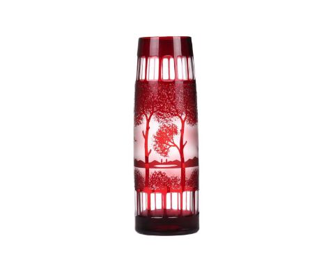 A 20th-century Wilhelm Kralik cameo glass vase, of tall cylindrical form with ruby tint, decorated with trees, 30.5 cm high.
