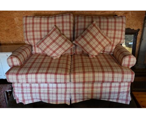 A modern loose covered Multi-York check pattern two seat sofa