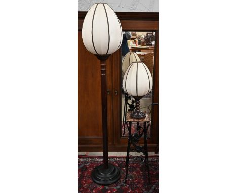 A turned hardwood standard lamp with lotus bud fabric shade, 183 cm high to/w a matching table lamp, 60 cm high (2)
