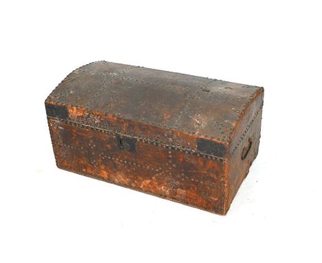 A George III brass studded leather clad dome top trunk, the paper lining with remnants of trade label for I Emes, London, 68 
