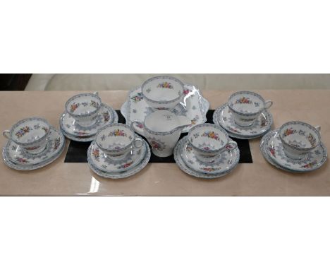 A Shelley 'Crochet' pattern china tea service comprising six each cups, saucers and plates, milk and sugar pair and a sandwic