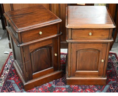 A pair of stained hardwood bedside cabinets each with a single drawer over arch-panelled cupboard door, 40 cm w x 40 cm d x 6