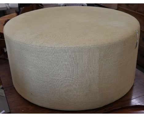 A circular centre stool with pale yellow woven fabric upholstery, 100 cm diam x 50 cm high