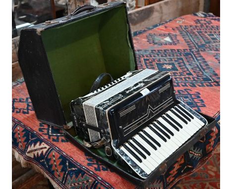 A Lorenzo green-marbled piano accordion with 24 pegs, in carrying case
