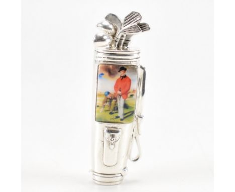 An 800 silver plated &amp; enamel gold bag vesta case. The vesta case in the form of a golfing bag full of clubs, inscribed S