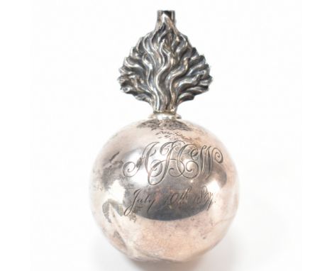 A 19th Century Victorian silver hallmarked 'grenade' table cigar lighter. The lighter having an orb shaped body with a moulde