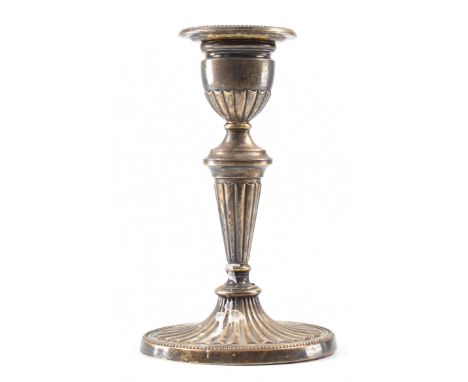 An antique Danish silver candle stick. The stick having an oval sconce with beaded rim, raised on a tapering knopped column o