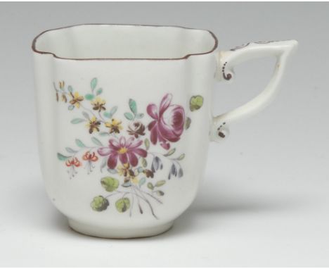 An early Derby quatrefoil coffee cup, painted in the manner of the Cotton-stem Painter in polychrome enamels with country flo
