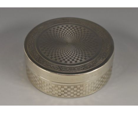 A French silver circular box, engine turned overall, 7cm diam, c.1920