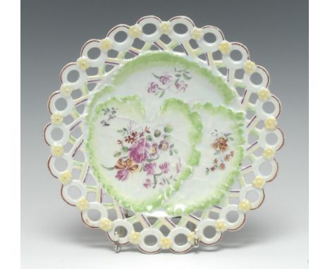 An early Derby leaf-moulded 'spectacle' plate, painted in the manner of the Cotton-stem Painter in polychrome enamels with co