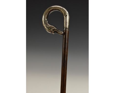 A late Victorian/Edwardian silver mounted novelty walking stick, the curved handle as the head of a duck, glass eyes, palmwoo