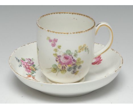 A Chelsea-Derby chocolate or milk cup, painted in polychrome with country flowers scattered on a white ground, grooved loop h
