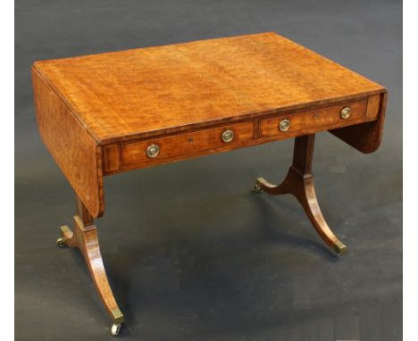 A Regency fiddleback mahogany sofa table, rounded rectangular top with fall leaves above a pair of frieze drawers, rectangula