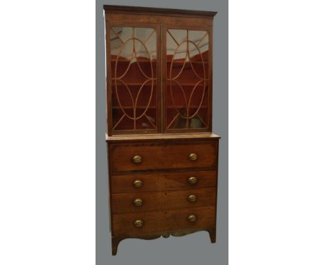 A George III mahogany secretaire bookcase, outswept cornice, dentil frieze, astragal glazed doors enclosing shelving, fitted 