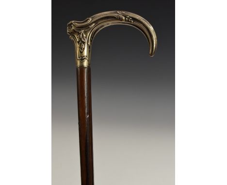 A French Art Nouveau period silver mounted walking stick, the curved handle embossed with sinuous scrolling acanthus, hardwoo