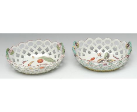 Two early Derby Patch Mark 'spectacle' baskets, painted in polychrome with ripe fruits, butterflies, caterpillars and insects