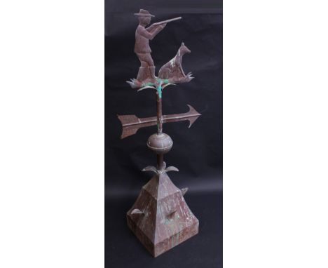 A 19th century style copper weather vane, the finial depicting a sportsman and his dog, spreading square base with leaf proje