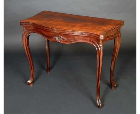 A George III French Hepplewhite mahogany concertina action serpentine card table, folding top enclosing an inset baize lined 