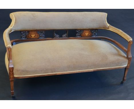 A Victorian mahogany salon sofa, stuffed-over back and seat, inlaid in coloured woods, tapering square legs, spade feet, cast