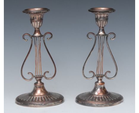 A pair of George III silver plated candlesticks, detachable nozzles, lyre shaped columns, 22cm high, c.1800; a pair of 19th c