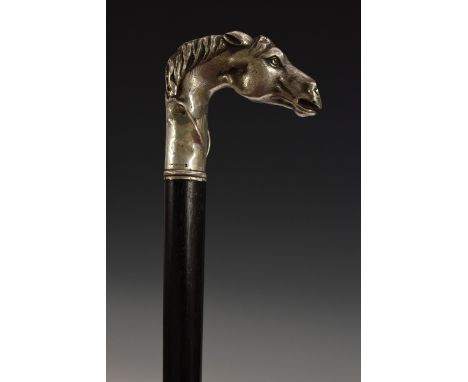 An early 20th century sterling silver mounted novelty walking stick, the L-shaped handle as a horse's head, ebonised shaft, 9