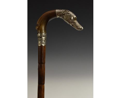 A silver mounted gentleman's novelty walking stick, the curved horn handle terminating in the head of a dog, palmwood shaft, 