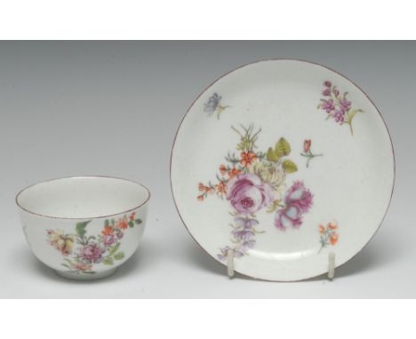 A Chelsea tea bowl and saucer, finely painted in polychrome enamels with Deutsche Blumen, iron red rims, the saucer 12.5cm di