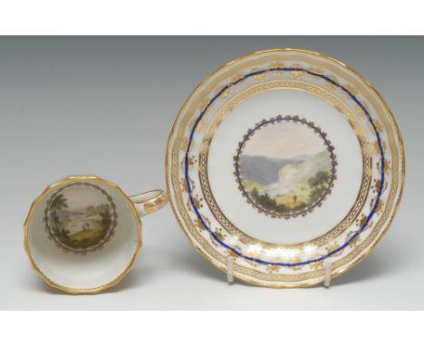A Derby fluted coffee cup and saucer, pattern no. 86, painted by Zachariah Boreman, in polychrome enamels and wash with Pictu