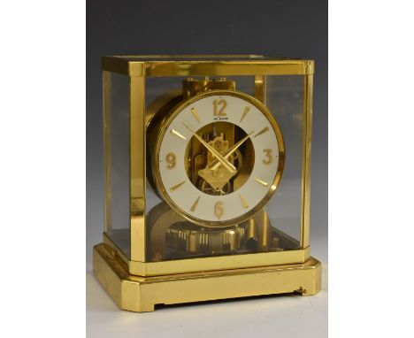 A Jaeger-LeCoultre Atmos clock, 12cm dial with baton markers and Arabic numerals to quarters, canted rectangular case, serial