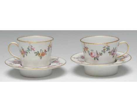 A pair of Derby trembleuse chocolate cups and saucers, inspired by contemporary Sèvres, painted in polychrome with garlands o