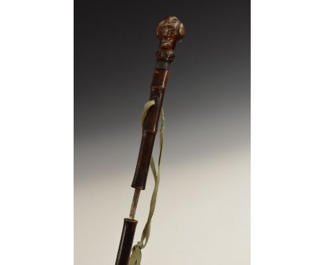 A 19th century novelty sword stick, the pommel as the head of Dr Syntax, 43cm blade, bamboo shaft, 73cm long overall