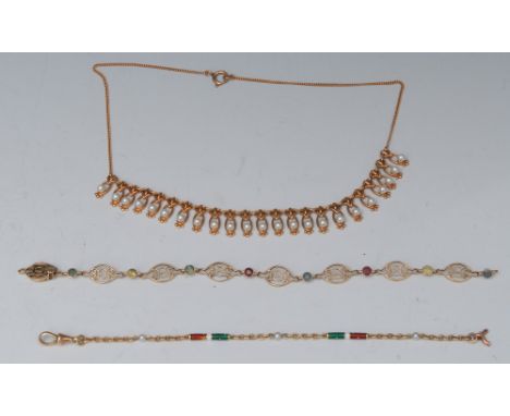 An 18ct gold red, white and green enamel and seed pearl bracelet, 17.5cm long; a gold coloured metal and precious stone brace