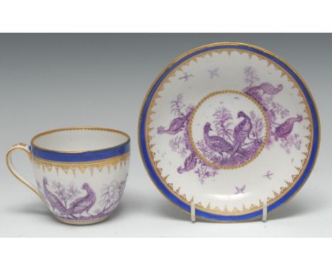 A Derby teacup and saucer, pattern 127, gilt Gothick tracery below a cobalt blue band, the base with a gilt beaded band, late