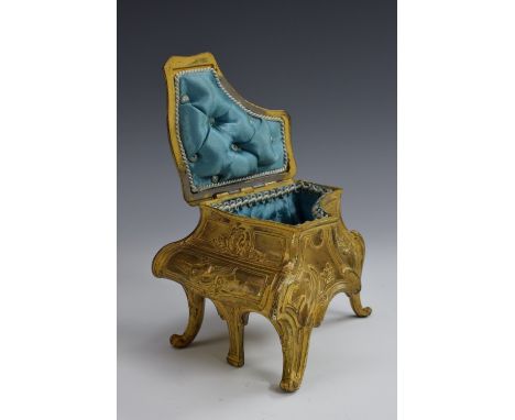 A 19th century French gilt metal novelty dressing table trinket box, as a boudoir piano, hinged cover enclosing a deep-button