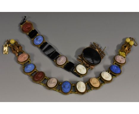 An unusual multi colour high relief cameo choker necklace, composed of ten carved panels in blue, red, pink, cream, grey and 