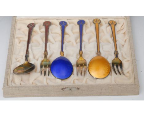 David Anderson -  a Sterling silver gilt and enamel fork and spoon, in yellow, others in red and blue, casedProvenance: From 