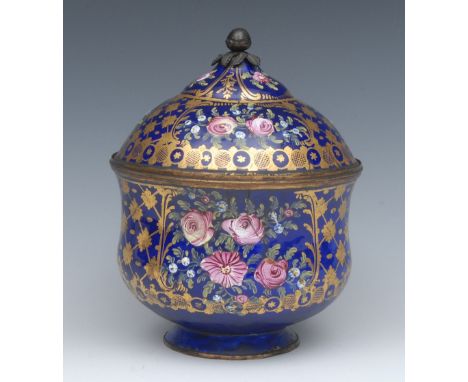 A 19th century enamel shaped baluster vase, double domed cover, decorated with roses and forget-me-nots on a cobalt blue, wit