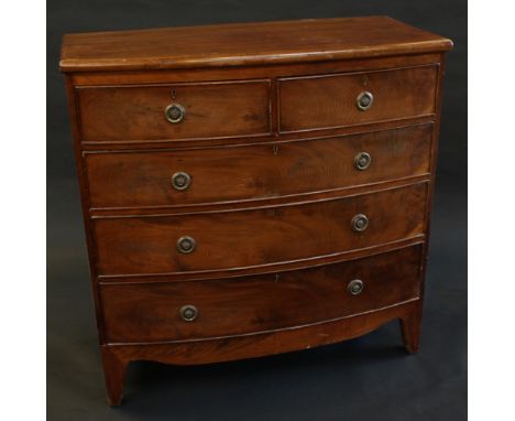 A late Victorian mahogany bow-fronted chest of drawers, in the George III taste, slightly oversailing top above two short and