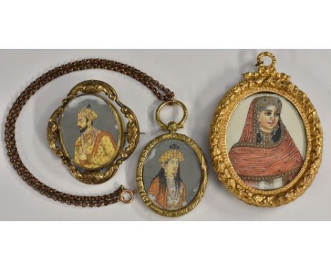 A 19th century mourning locket brooch, inset with a portrait of a Maharaja, ornate yellow metal frame;  others Maharani penda