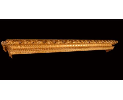 A 19th century giltwood Country House architectural pelmet, boldly carved with scrolling acanthus, 246cm long
